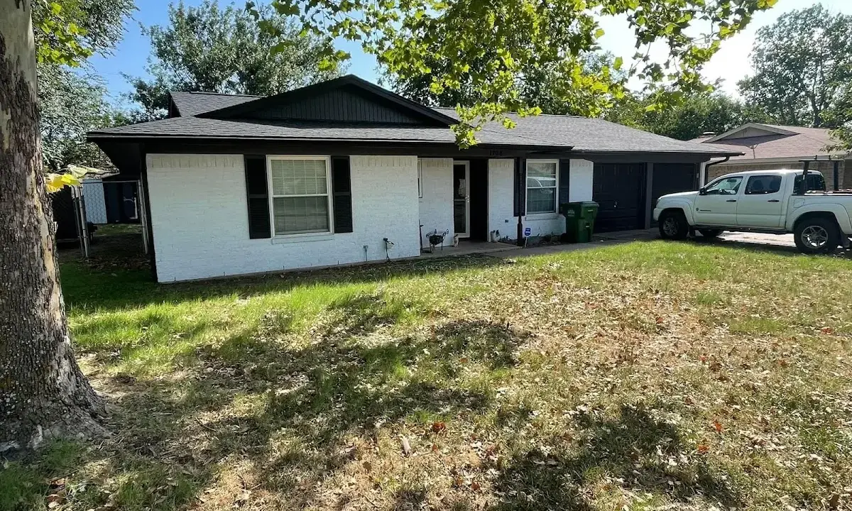 Professional roofing crew working on a residential roof in Estacada